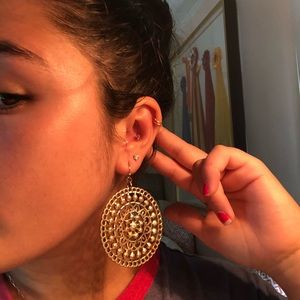 Gold circle dangly earrings